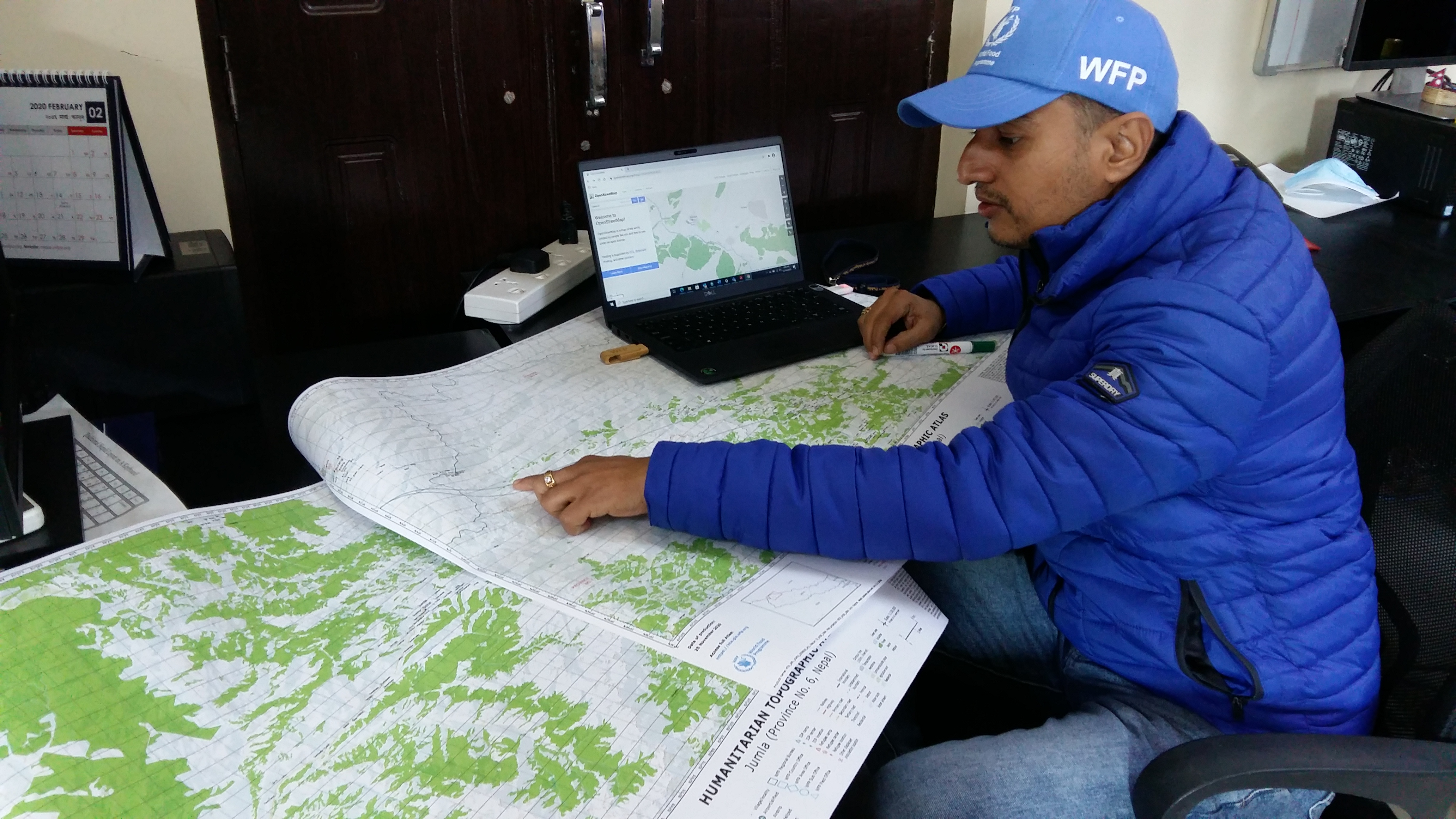 WFP associate using an HTA map. Photo by Shailja Ale, WFP
