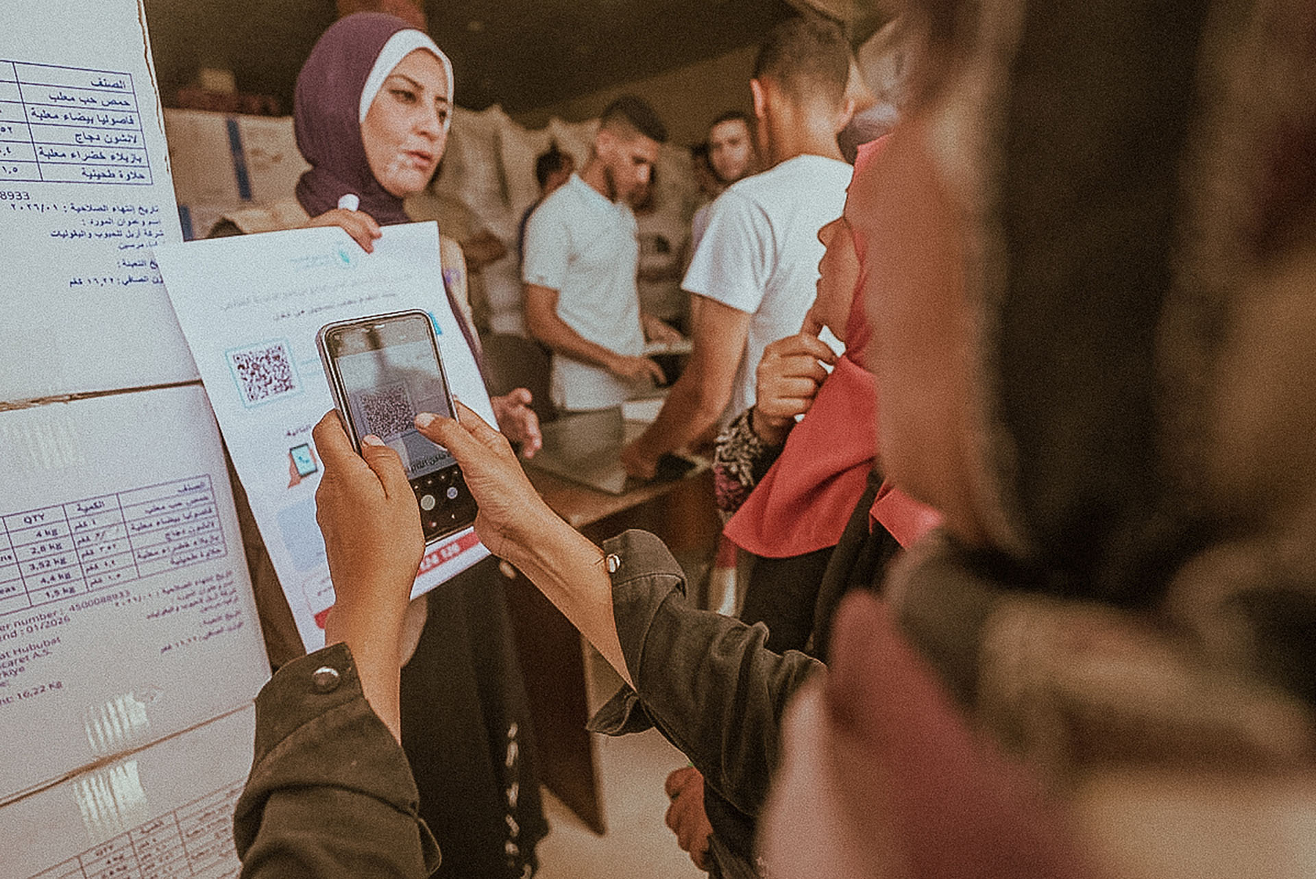 Woman scans a QR code.