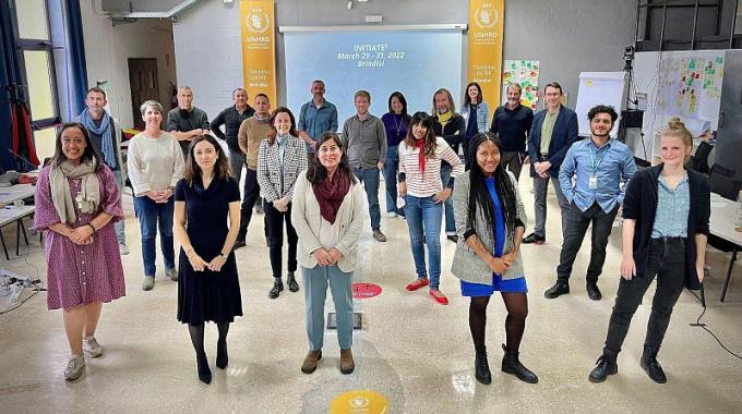 0_aG6WC4_8k8bjXa4i.jpg INITIATE partners stand together during their workshop