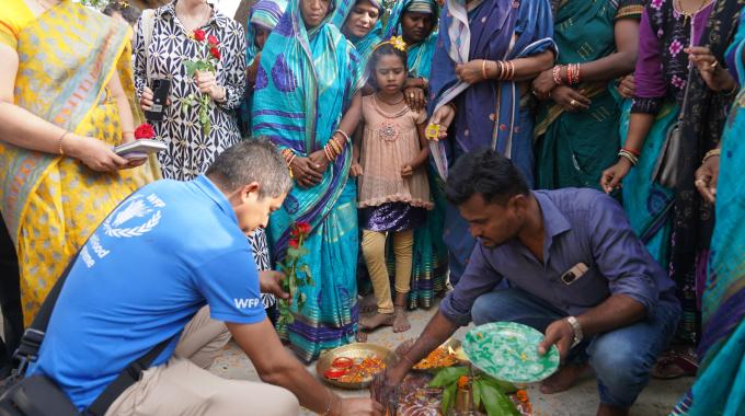 People from the Odisha state government, WFP, and the local community take part in a traditional blessing, for the new Solar4Resilience