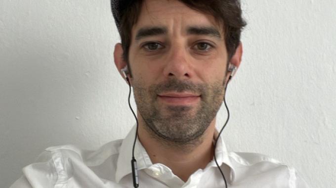 Photo of Hugo Marchand wearing a hat on a white background.