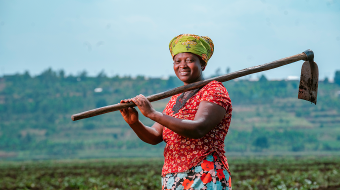 Smallholder farmer Mukakarisa Blandine joined a small group in a cooperative to work together to be able to buy fertilizer for her crops