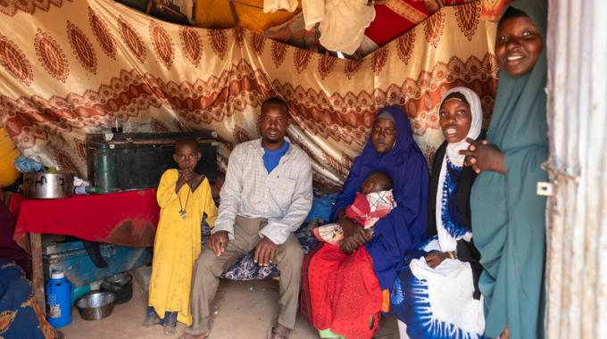 A newly arrived refugee family poses for a photo in Kenya