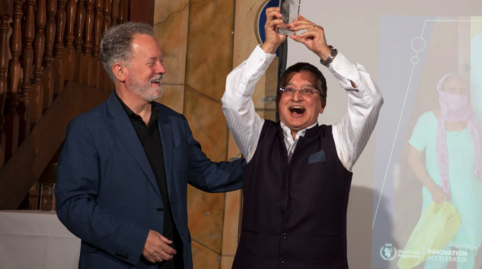 WFP Executive Director, David Beasley, congratulates one of the award winners. Photo: WFP/Rein Skullerud.