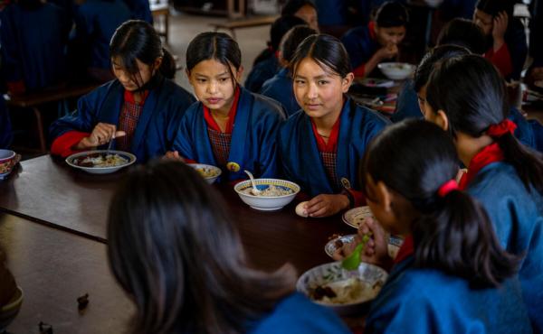 Pupils of Buli Central School enjoying a school meal provided through the Ministry of Education and Skills Development’s National School Feeding and Nutrition Programme. Throughout 2024, WFP supports the ministry with the design of nutritious meals through School Menu Planner (SMP) PLUS tool. © WFP/Rein Skullerud