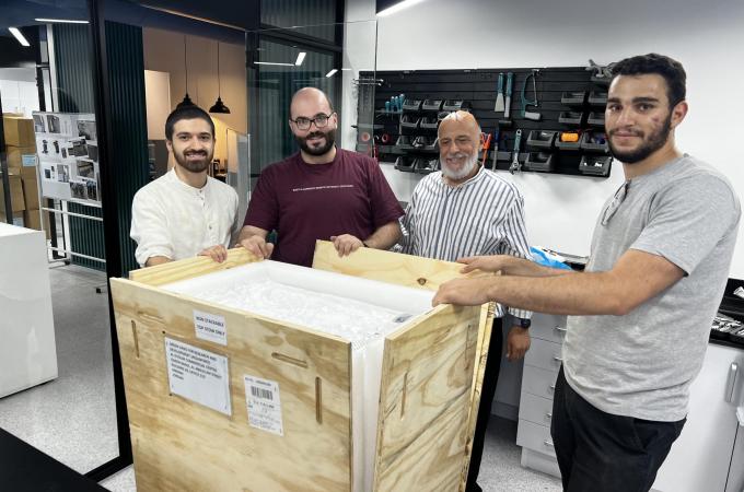 The AquaPoro team (from left to right: Obeida Mudraj, Husam Almassad, Fouad Rihani, and Suhaib BaniHani) unboxes the first manufactured sample of WaHa