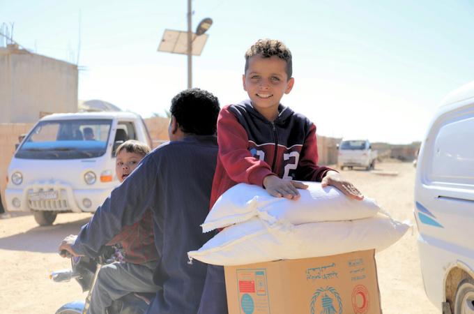 Displaced Syrian families receiving food assistance in Maskaneih city. | Photo: WFP/Marwa Bana